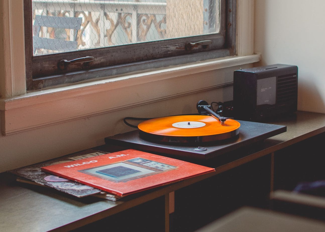 Record Player with Orange Record near Window