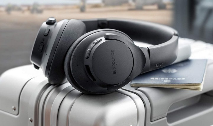 close up headphone on travel luggage and passport